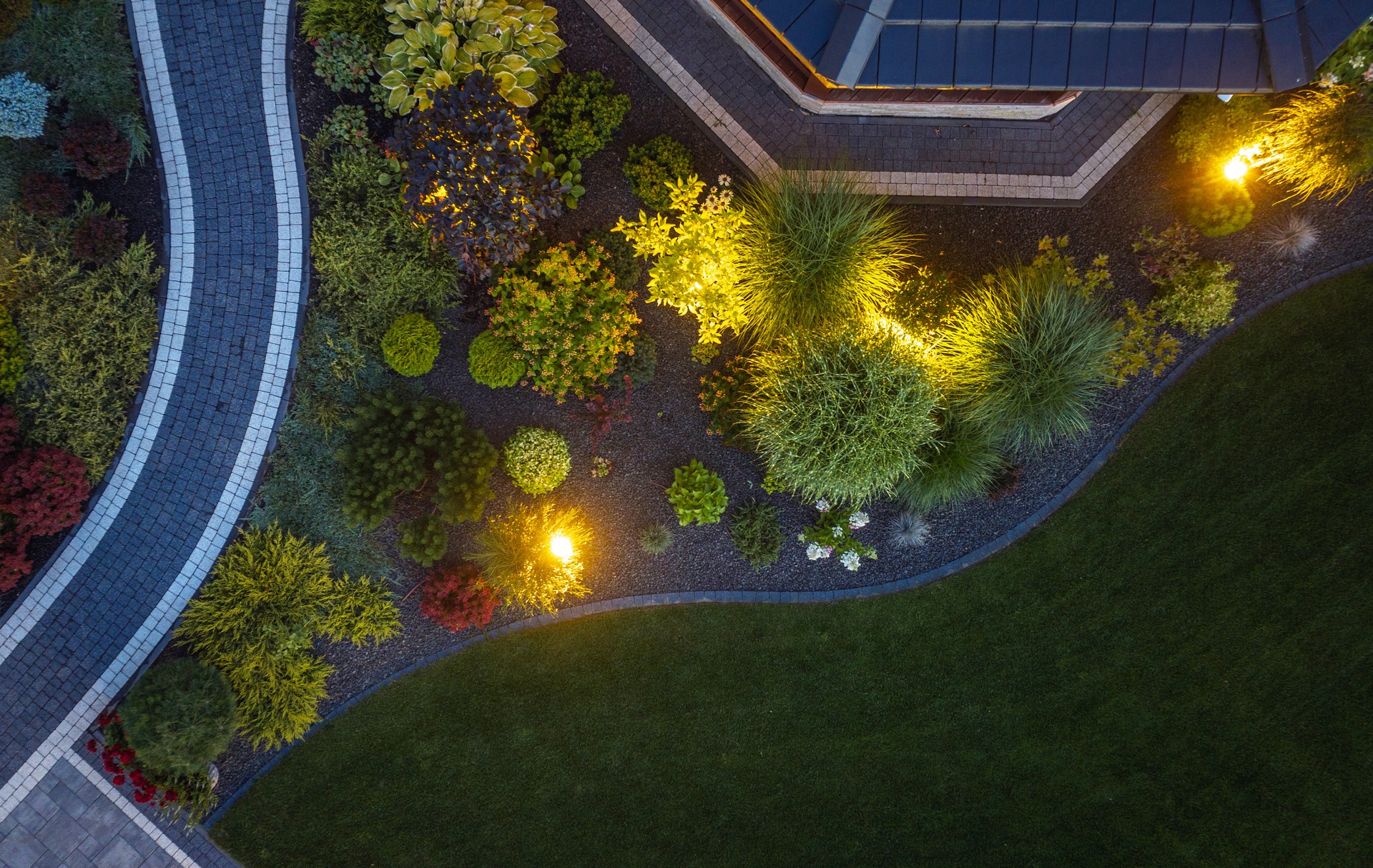 Elegant LED Illuminated Residential Back Yard Garden Aerial View.